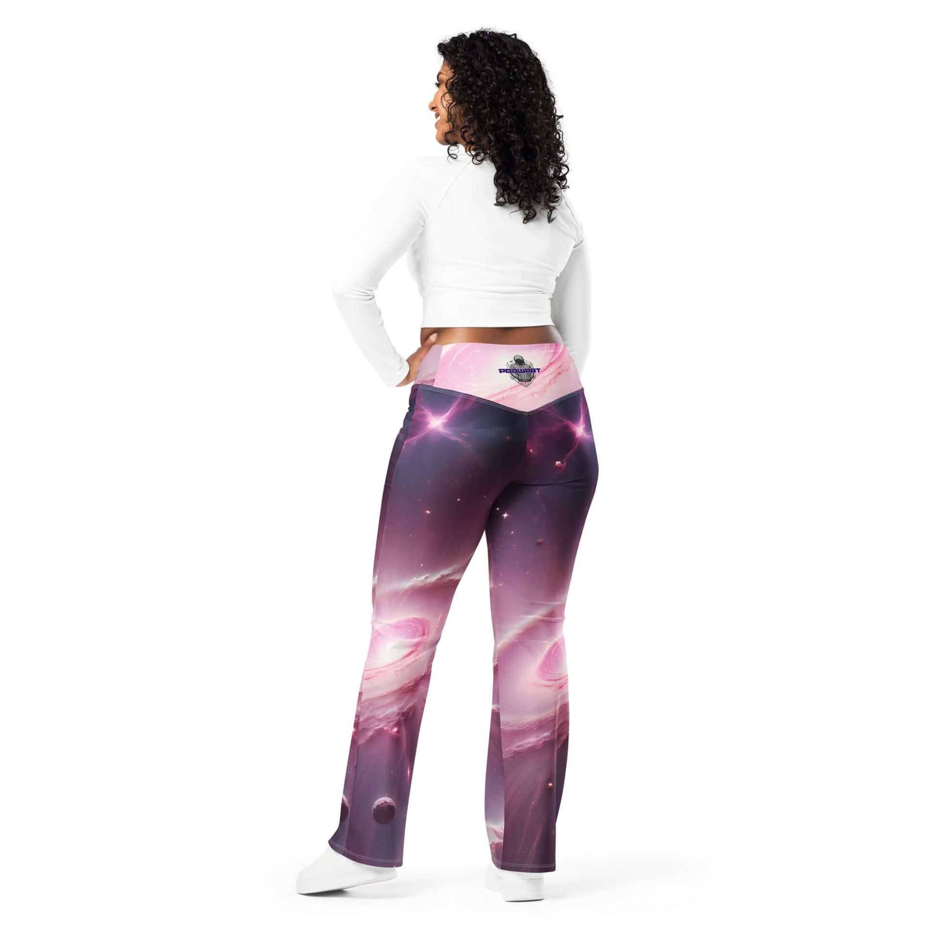 Women’s pink cosmic leggings with a flared cut and vibrant space-inspired design.