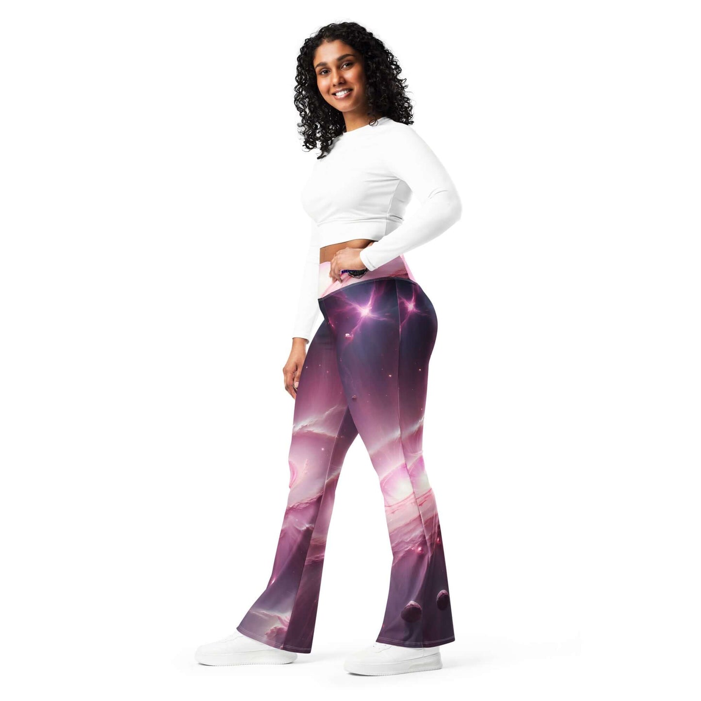 Women’s pink cosmic leggings with a flared cut and vibrant space-inspired design.